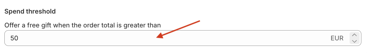 Red arrow pointing to the Spend threshold option of the Mintt - Free Gift app.